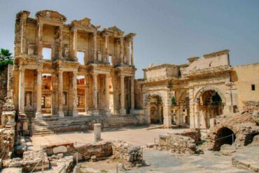 Ancient ruins of the Celsus Library in Ephesus, Turkey, showcasing grand columns and intricate stone carvings.